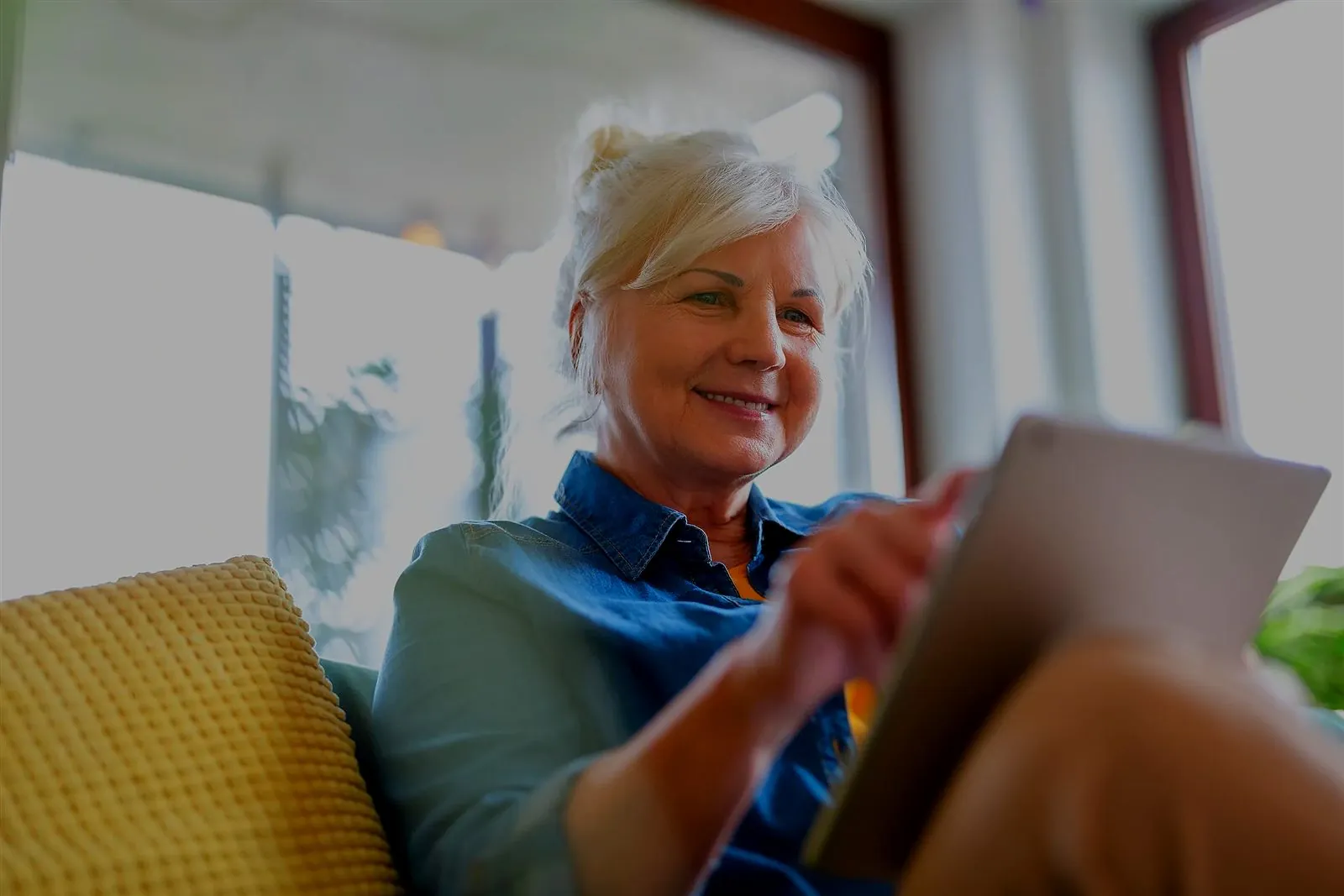 A licensed clinician reading the week's check-ins on a tablet.